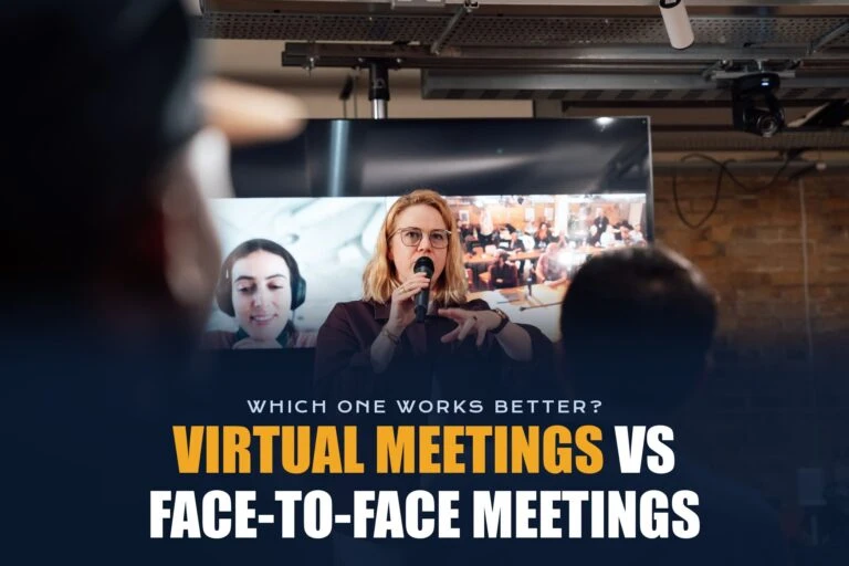 Presenter speaking in a meeting room while remote colleagues appear on a large screen